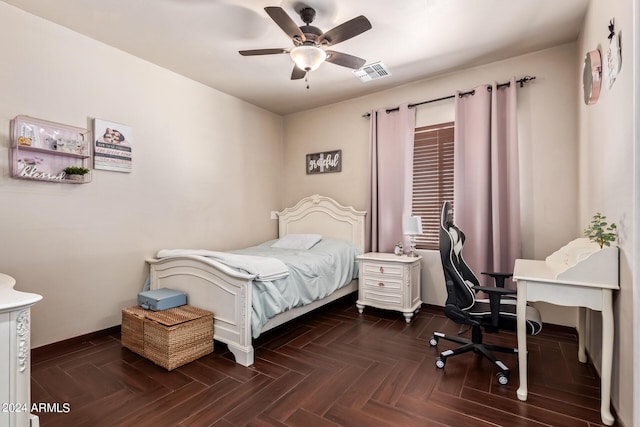 bedroom featuring ceiling fan and dark parquet floors