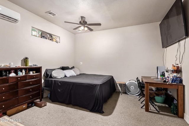 bedroom featuring an AC wall unit, light carpet, and ceiling fan