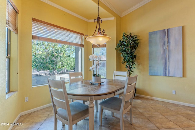 tiled dining area featuring crown molding