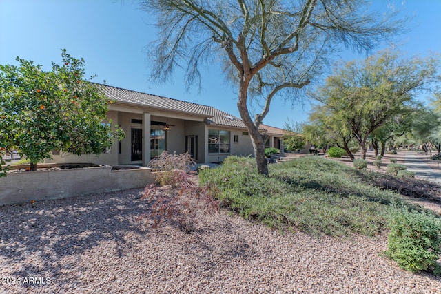 view of front of home with ceiling fan