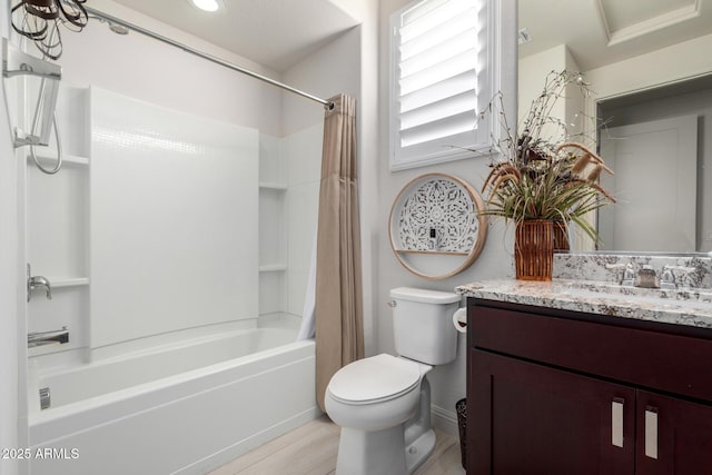 full bathroom featuring wood-type flooring, shower / bath combo with shower curtain, vanity, and toilet