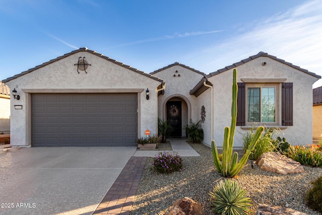 mediterranean / spanish-style house featuring a garage