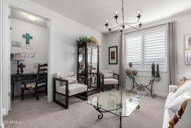 sitting room featuring light colored carpet and an inviting chandelier