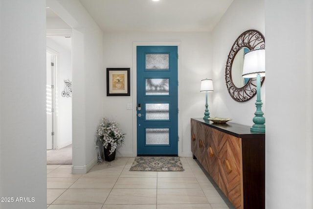 entrance foyer with light tile patterned floors