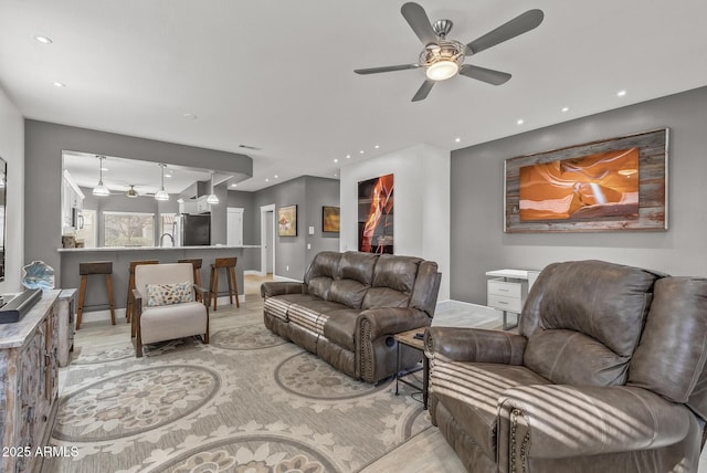 living area with recessed lighting and ceiling fan