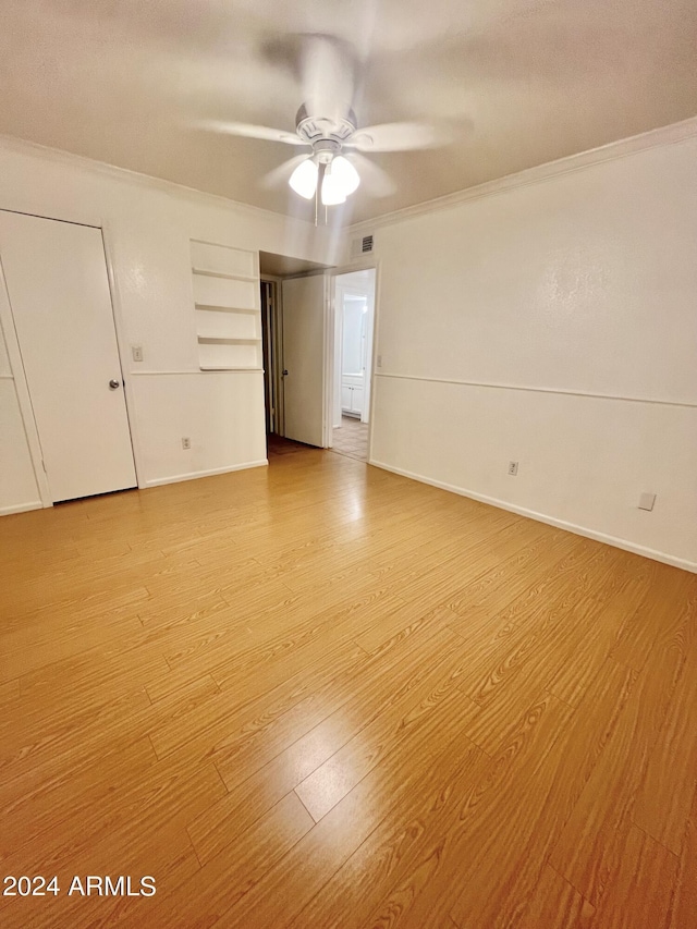 unfurnished bedroom with crown molding, light hardwood / wood-style flooring, and ceiling fan