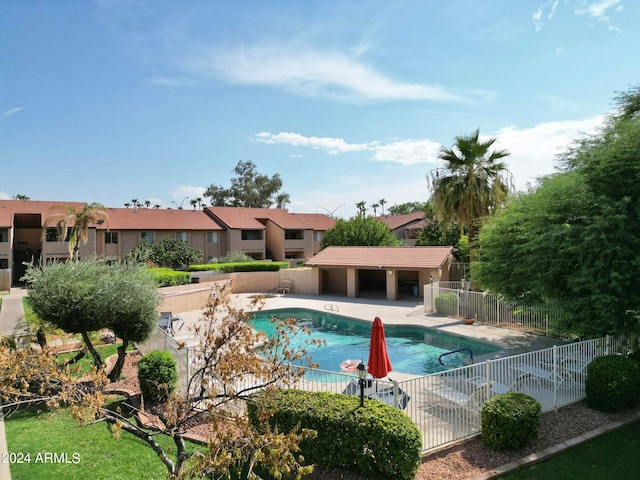 view of swimming pool with a patio area