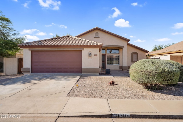 10304 E Plata Ave, Mesa, AZ 85212 - mediterranean / spanish-style house with stucco siding, driveway, an attached garage, and a tile roof