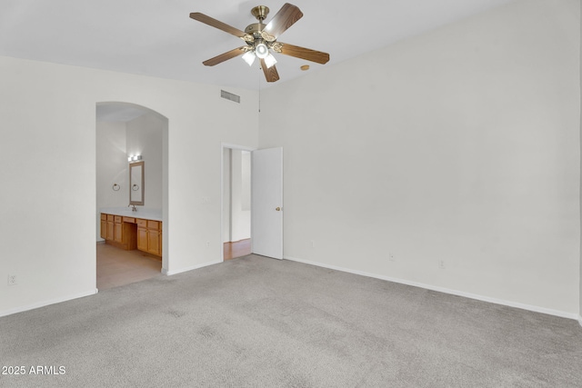 10304 E Plata Ave, Mesa, AZ 85212 - unfurnished room featuring arched walkways, light colored carpet, and ceiling fan