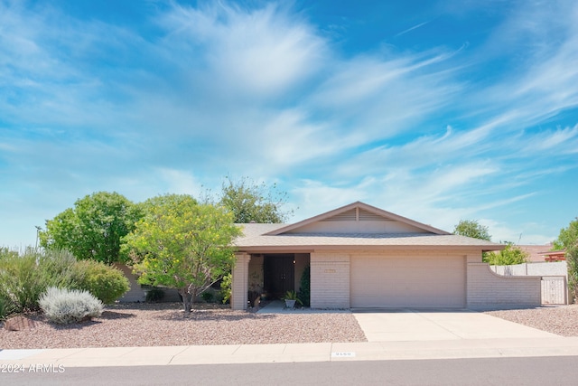 ranch-style home featuring a garage