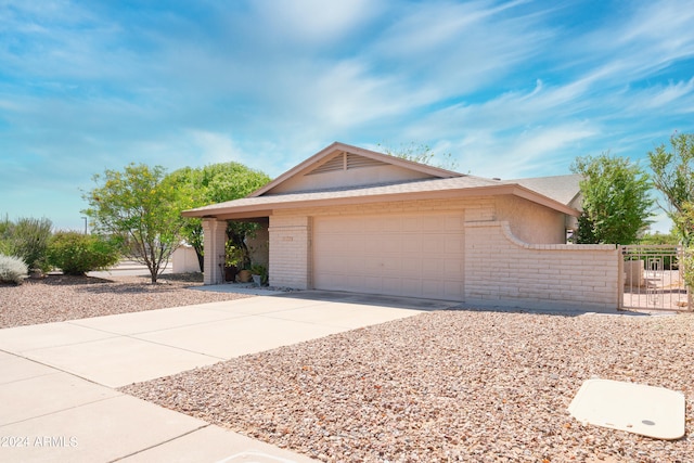 ranch-style house featuring a garage