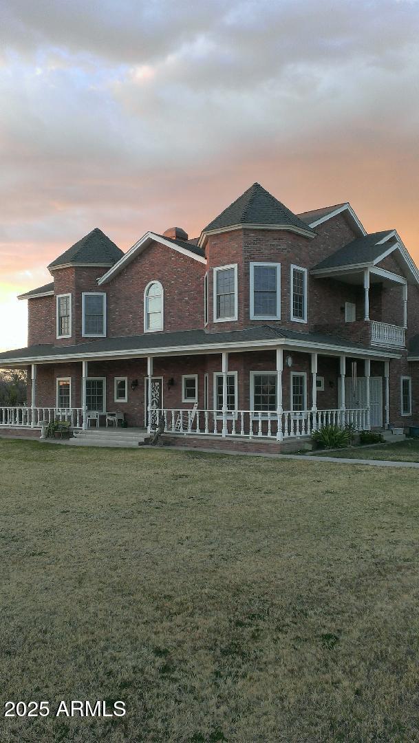 view of front of home with a lawn