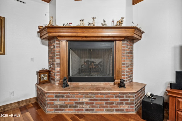 details featuring a fireplace and hardwood / wood-style flooring