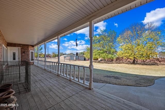 wooden deck with a lawn