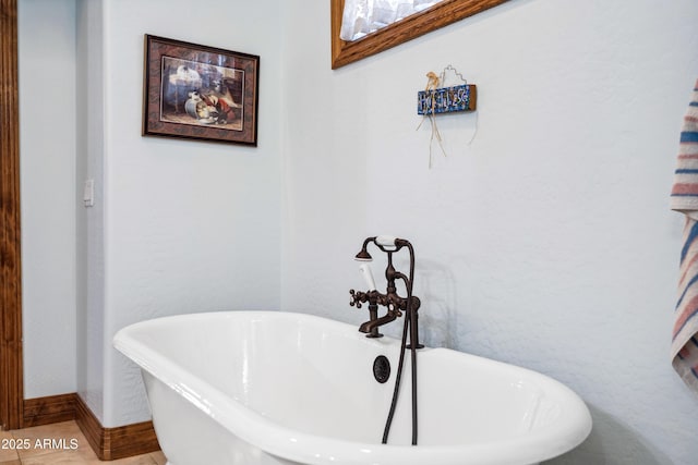 bathroom with a bathing tub and tile patterned floors