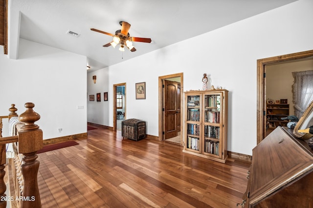 living room with ceiling fan and wood-type flooring