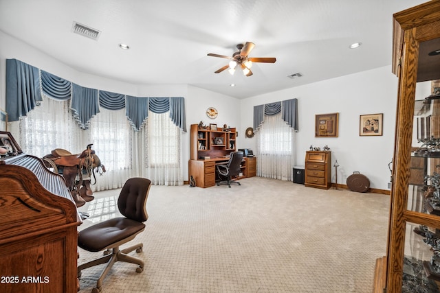 office area featuring ceiling fan, a healthy amount of sunlight, and carpet floors