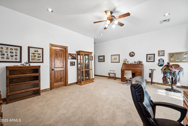 office with ceiling fan and light colored carpet