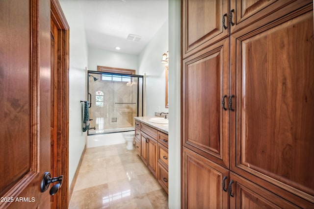 full bathroom featuring combined bath / shower with glass door, vanity, and toilet