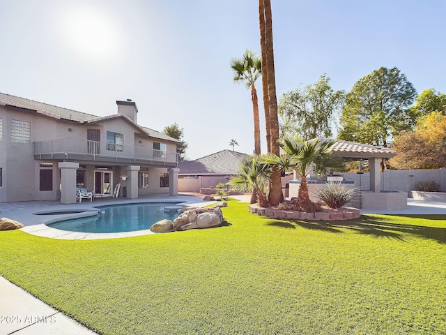 view of pool with a yard and a patio