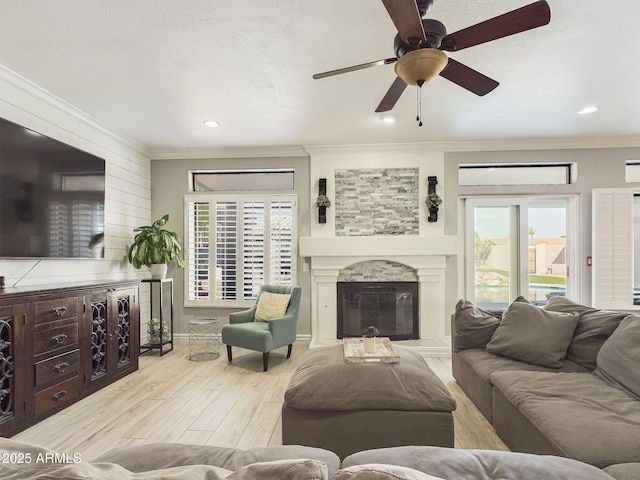 4530 W Misty Willow Ln, Glendale, AZ 85310 - living room with ceiling fan, a healthy amount of sunlight, light wood-type flooring, and ornamental molding