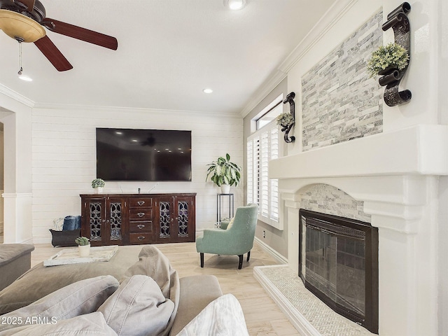 4530 W Misty Willow Ln, Glendale, AZ 85310 - living room with ceiling fan, light wood-type flooring, ornamental molding, and wooden walls