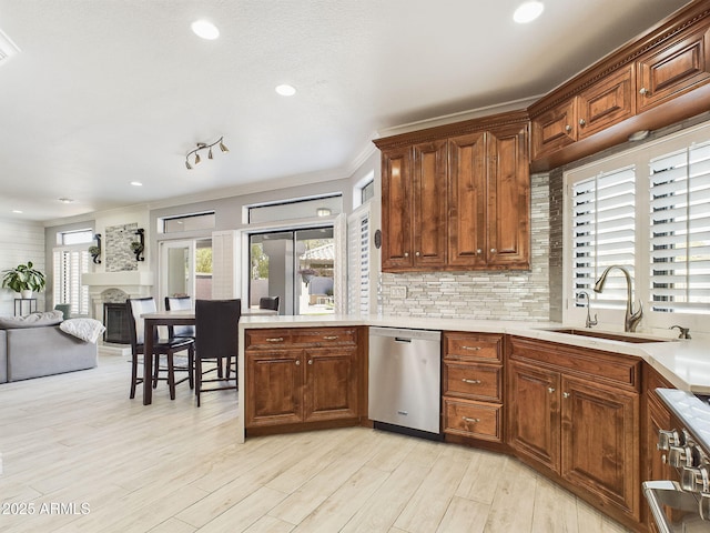 4530 W Misty Willow Ln, Glendale, AZ 85310 - kitchen with dishwasher, sink, decorative backsplash, ornamental molding, and light hardwood / wood-style floors