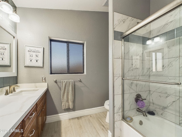 4530 W Misty Willow Ln, Glendale, AZ 85310 - full bathroom featuring hardwood / wood-style flooring, vanity, toilet, and shower / bath combination with glass door