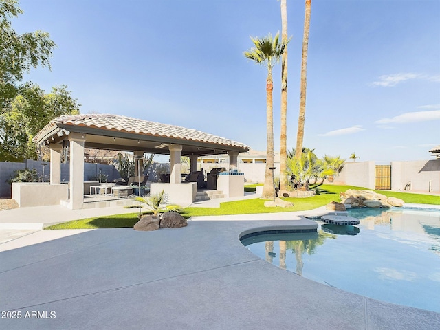 4530 W Misty Willow Ln, Glendale, AZ 85310 - view of pool featuring an outdoor kitchen and a patio