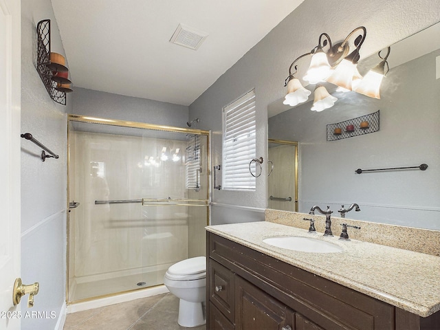 4530 W Misty Willow Ln, Glendale, AZ 85310 - bathroom featuring toilet, vanity, tile patterned floors, and an enclosed shower