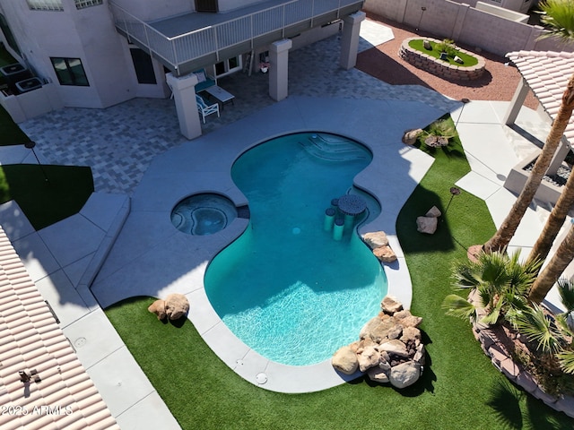 4530 W Misty Willow Ln, Glendale, AZ 85310 - view of swimming pool featuring an in ground hot tub and a patio
