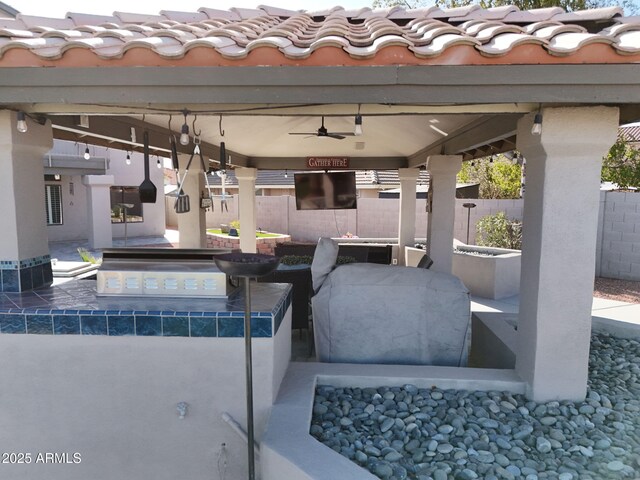 4530 W Misty Willow Ln, Glendale, AZ 85310 - view of patio featuring ceiling fan and exterior kitchen