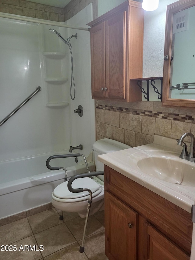 720 N 82nd St Unit E116, Scottsdale, AZ 85257 - bathroom featuring toilet, decorative backsplash,  shower combination, vanity, and tile patterned flooring