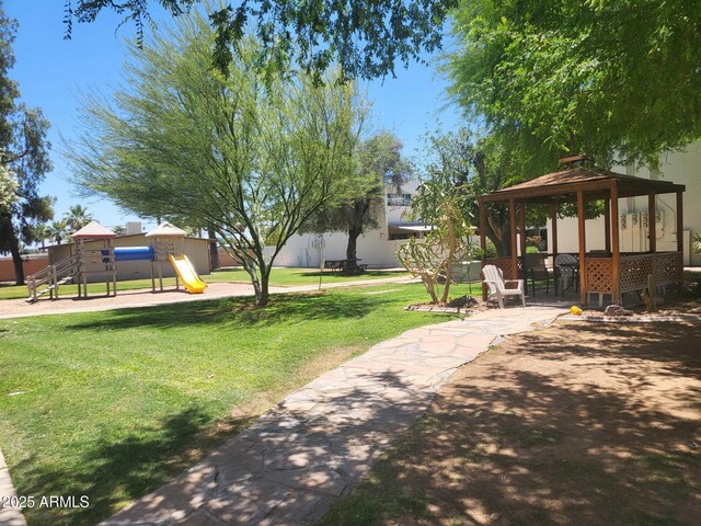 720 N 82nd St Unit E116, Scottsdale, AZ 85257 - view of green lawn featuring a gazebo and a playground