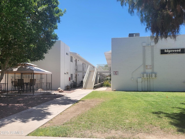 720 N 82nd St Unit E116, Scottsdale, AZ 85257 - view of property featuring stairs