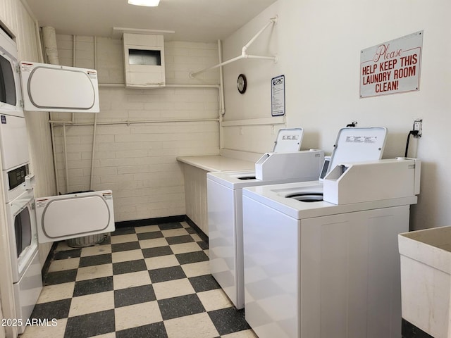 720 N 82nd St Unit E116, Scottsdale, AZ 85257 - shared laundry featuring separate washer and dryer and tile patterned floors