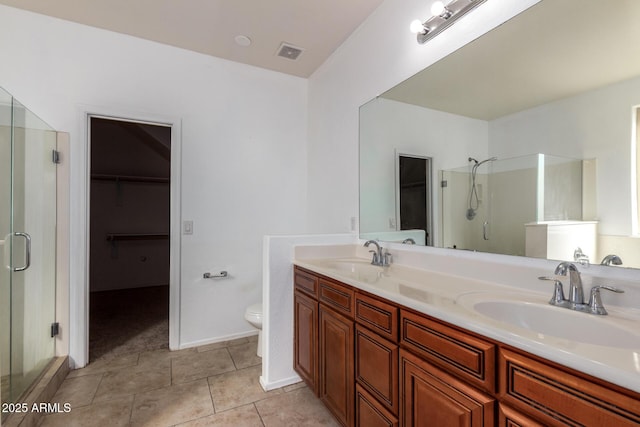 full bathroom with tile patterned flooring, a sink, visible vents, and a shower stall