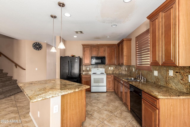 kitchen featuring visible vents, a center island, light stone countertops, black appliances, and a sink