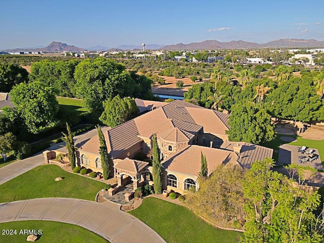 birds eye view of property with a mountain view