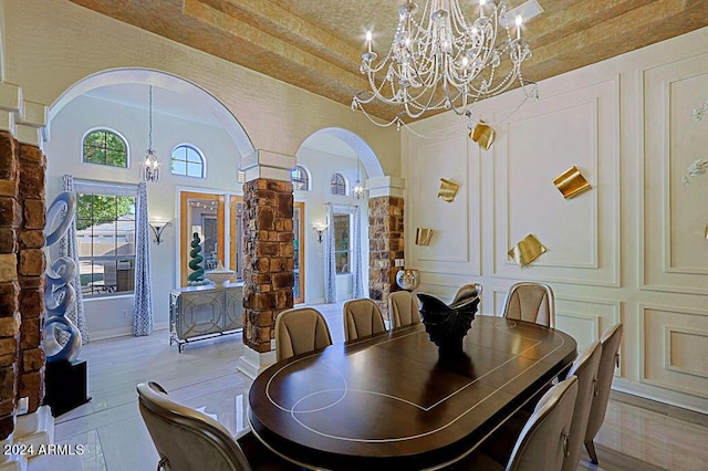 dining space with an inviting chandelier