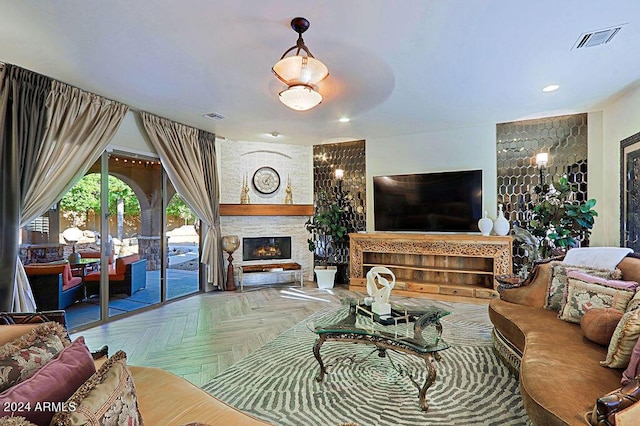 living room with parquet floors and a fireplace