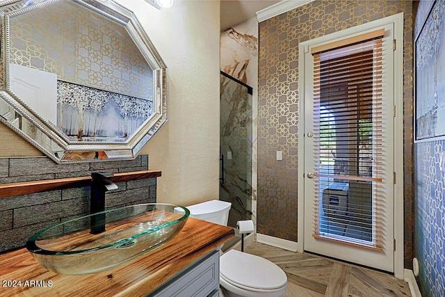 bathroom with ornamental molding, toilet, walk in shower, and parquet floors