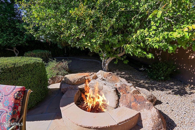 view of yard with a fire pit