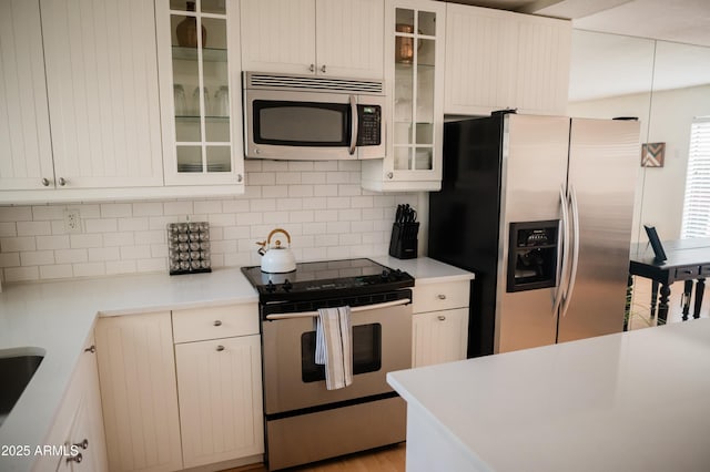 kitchen featuring tasteful backsplash and appliances with stainless steel finishes