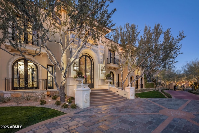 view of front of house featuring stucco siding