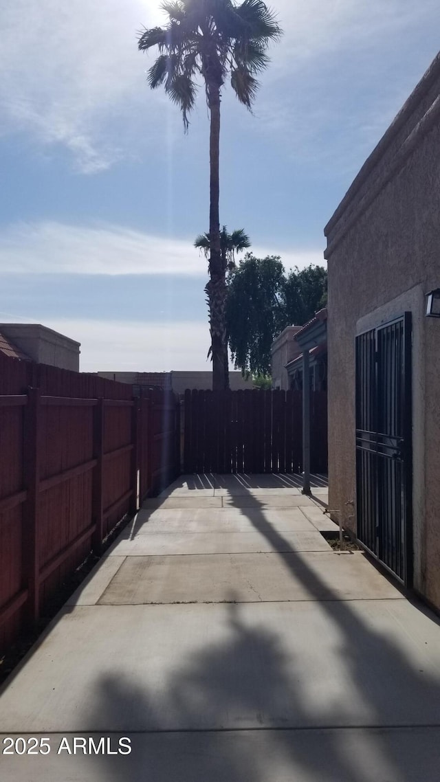 view of patio featuring fence