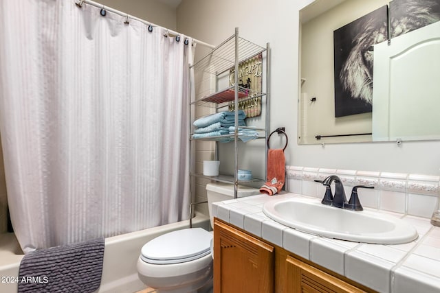 bathroom featuring toilet, vanity, and shower / bath combination with curtain