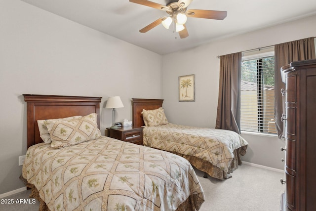 carpeted bedroom with baseboards and ceiling fan