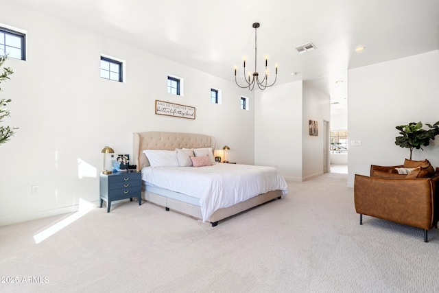 bedroom featuring a notable chandelier, light carpet, and multiple windows