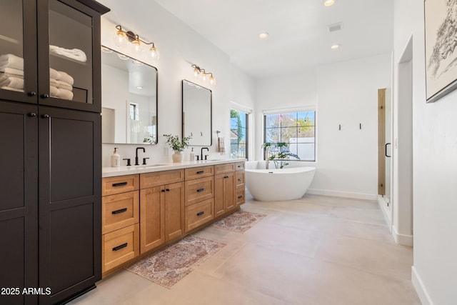 bathroom featuring vanity, shower with separate bathtub, and tile patterned floors